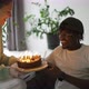 Young Family Celebrating Man&#39;s Birthday Wife Brought the Cake to Blow Out Candles - VideoHive Item for Sale