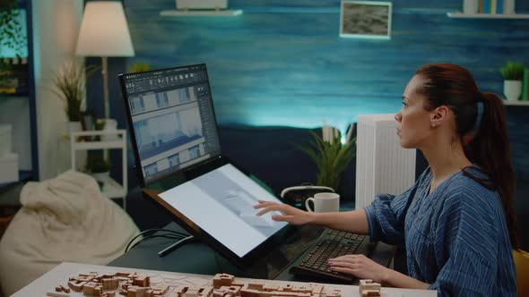 Young Engineer Using Technology for Construction Design alt