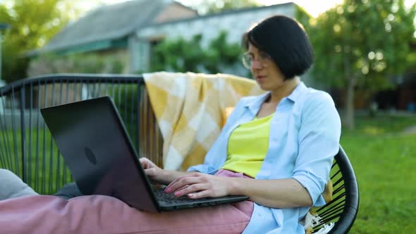 Woman using typing , search on laptop for alternative office freelance