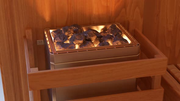 Wooden Finnish sauna interior with a heating spot filled with hot stones. alt