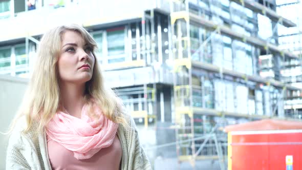 Thoughtful Woman On Front Of New House alt