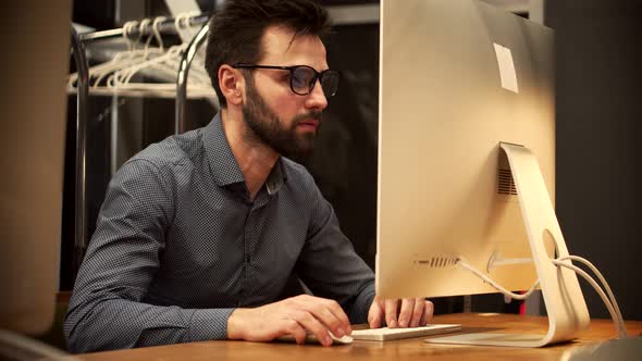 Businessman Working Alone. Man Chatting In Office Computer At Night. Graphic Designer Overworked. alt