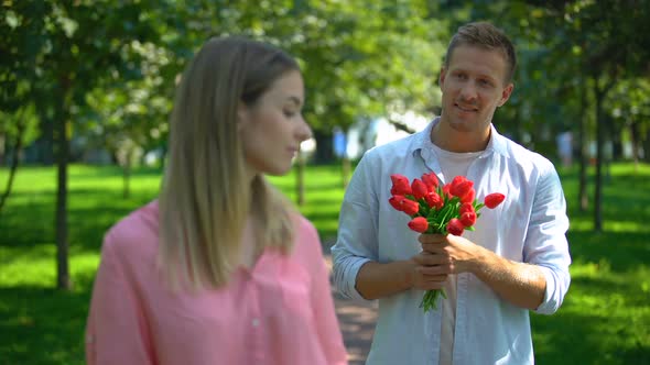 Man Bringing Girl Bunch of Flowers, Annoyed Lady Rolling Eyes, Unrequited Love alt