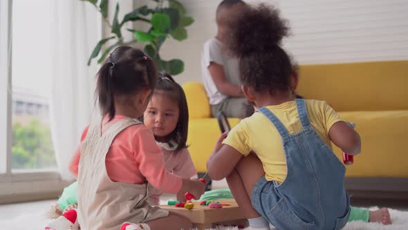 Children playing toy and game in living room, Group of Little girls and boy mould from plasticine