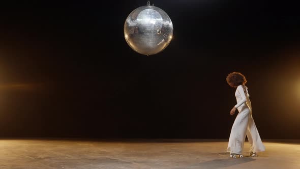 Charming African American Woman Wearing Roller Skates Rides Around on the Stage alt