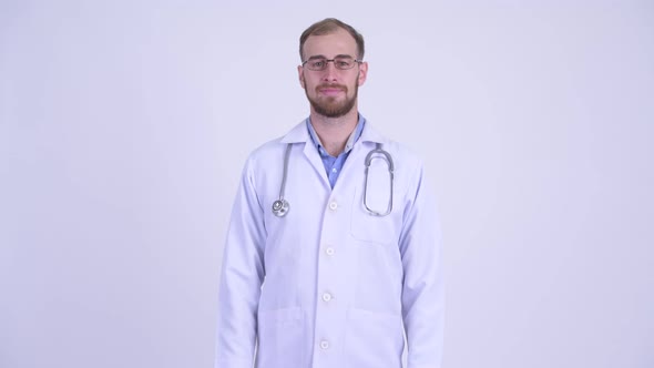 Happy Bearded Man Doctor with Eyeglasses Smiling
