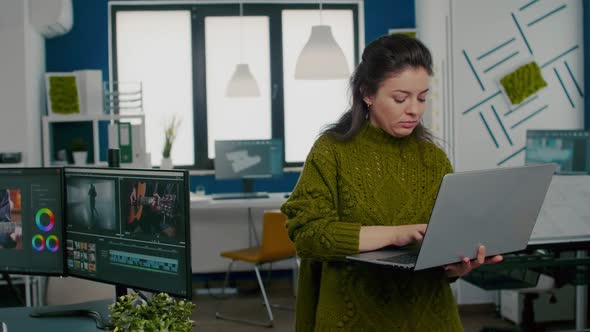 Employee Looking at Camera Smiling Standing in Front of Camera alt