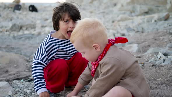 Two Travel Friends Sit on the Beach alt