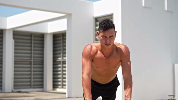 Shirtless handsome sports man doing close grip push up exercise