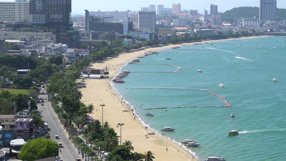 Pattaya beach and harbor, famous seaside tourist resort city, in sunny day, Chonburi, Thailand