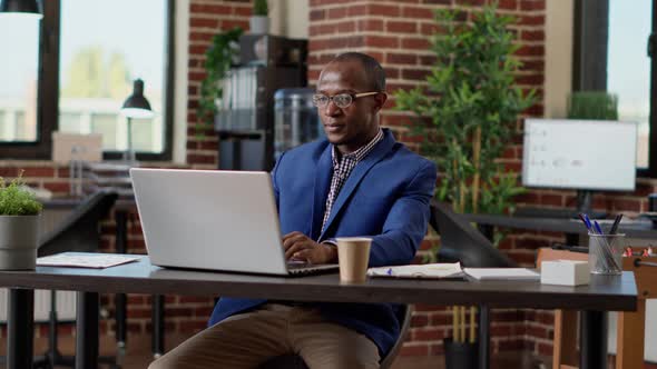 Happy Businessman Celebrating Project Success in Startup Office alt