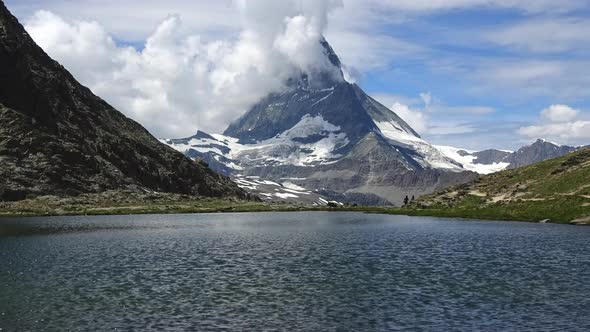 Time-lapse view on snowy Matterhorn peak and lake Stellisee, Swiss Alps, Zermatt