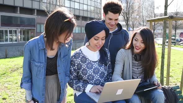 Mixed race group man using computer chatting