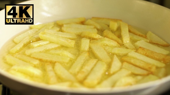 Cooking french fries Frying potatoes