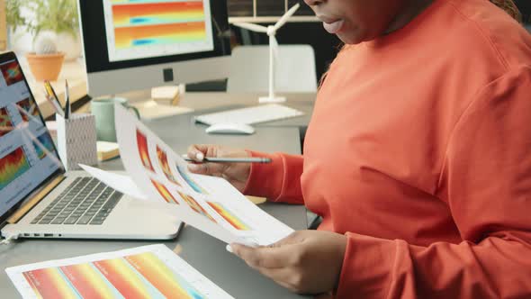 Female Engineer in Wheelchair Working on Sustainable Energy Project alt