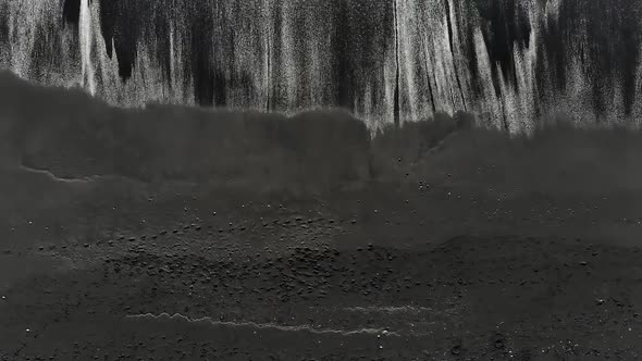 Aerial View. Black Sand Beach. Beautiful Ocean Waves Crashing on Coastline. alt