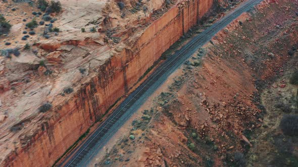 Aerial of rail line made over the canyon. Aerial forwarding shot over picturesque famous grand canyo alt