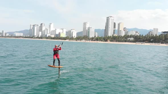 Professional Kite Surfer on the Sea Wave, Athlete Showing Sport Trick Jumping with Kite and Board in alt