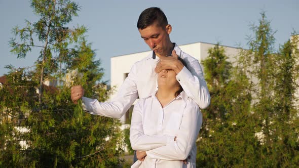 Young Disabled Man Gives Bouquet of Chamomile to Woman alt