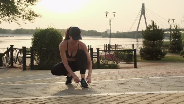 Female Sport Fitness Runner Getting Ready for Jogging Outdoors on Way alt