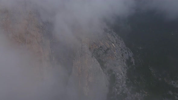 Rock ShaanKaya with Sheer Walls and Overgrown with Coniferous Forest Crimea alt