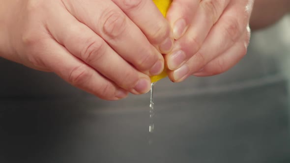 Chef Hands Squeeze Out Lemon Juice