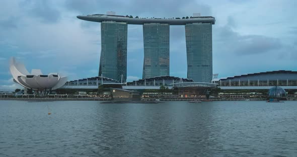 Marina Bay sands of Singapore viewed from across the lake with water reflection and Artscience museu alt
