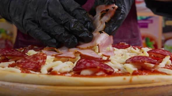 Close Up View of a Man Chef Cooking Italian Pizza. The Process of Making Pizza at Table . Fresh alt