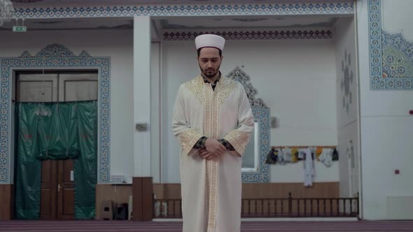 a Young Man Praying in the Mosque alt