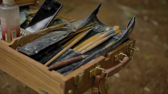 Artist's Tools, Brushes and a Tube of Paints in a Wooden Box. alt