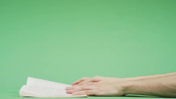 Reading a book and turning the page alt