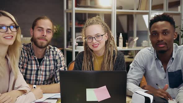  Young Multiethnic Office Colleagues Showing thumbs Up and Looking at Camera alt