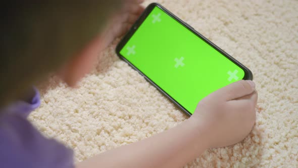 kid boy preschool with gadget playing video games digital on mobile phone alt