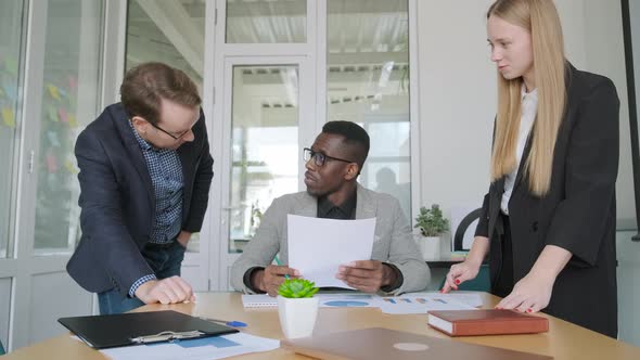 Three Business People Have Meeting Consultation in Office Discussing Project