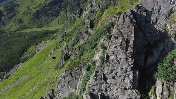 Aerial view of rocky peak of Spitz mountain in the Carpathian mountains, landscape alt