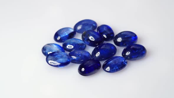 Natural Kyanite Gemstone on the White Background on the Turning Table alt
