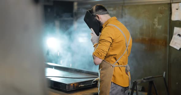 Welder Portrait at the Workshop alt