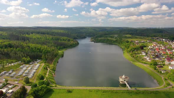 Movie of drone flight over Twiste lake and dam in the German area of Northern Hesse during daytime alt