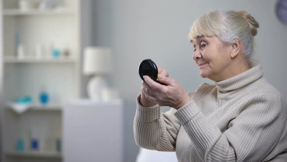 Elegant Old Woman Applying Skin Powder and Refusing Medical Pills, Nursing Home alt