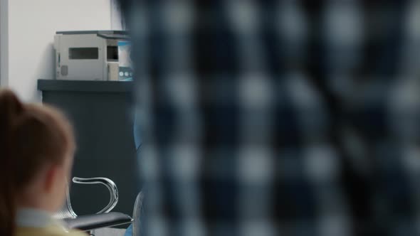 Portrait of Senior Wheelchair User Sitting in Waiting Room Area alt