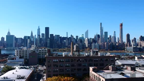 Waterfront High-rise Buildings In Hunter's Point Across East River With Blue Sky In Background In Lo alt