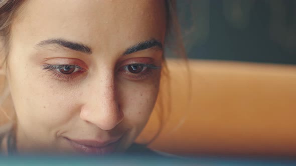 Extreme Closeup Young Pretty Woman Joyfuly Looking at Laptop Screen alt