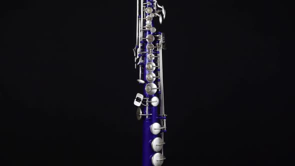 Blue Soprano Saxophone On A Black Background.