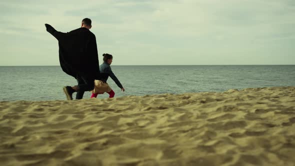 Family Running Sea Beach alt