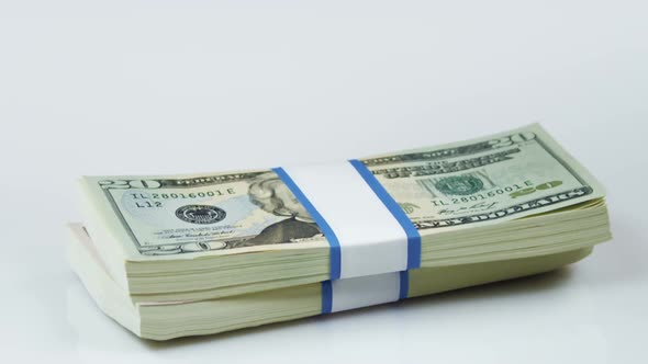 Bundles of American currency appearing alt