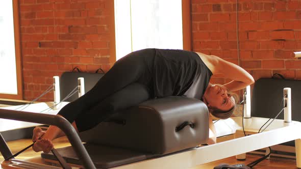 Woman performing stretching exercise alt