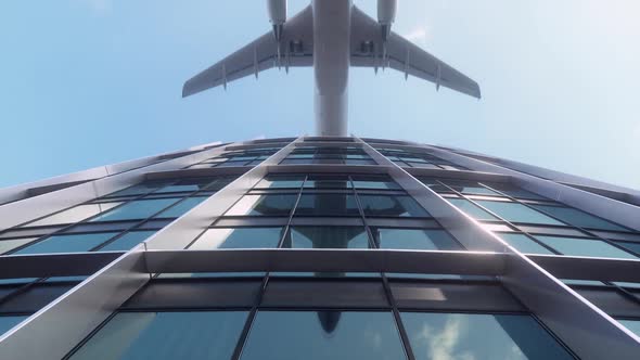 Airplane flying above high rise building and reflects on glass facade. Modern city district. alt