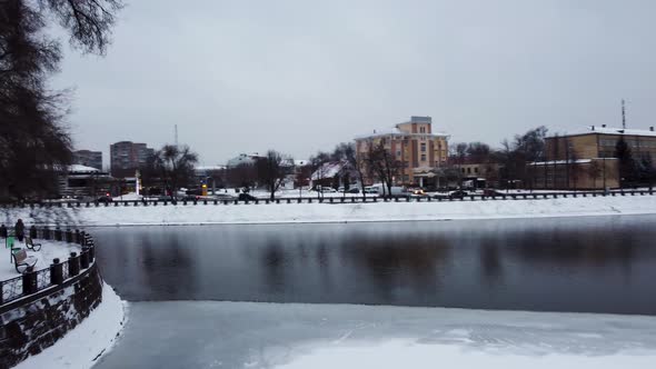 Pedestrian bridge on winter river in Kharkiv city