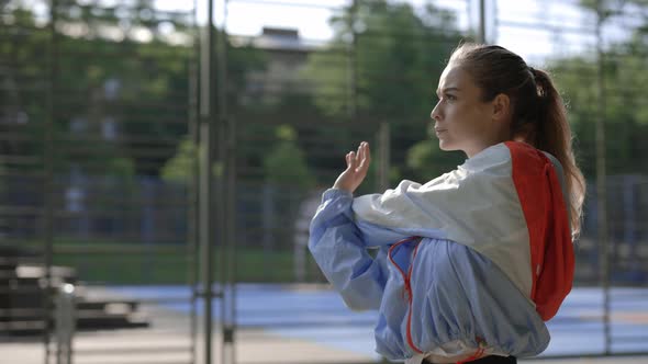 Close Up Side View of Young Caucasian Woman Doing the Workout alt