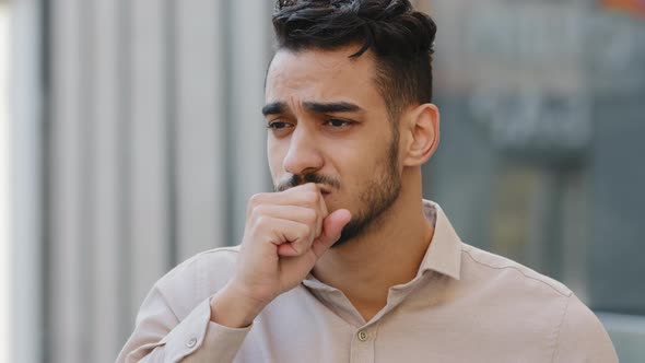 Portrait of Unhappy Indian Sick Guy Coughing Suffers Symptoms of Covid19 alt